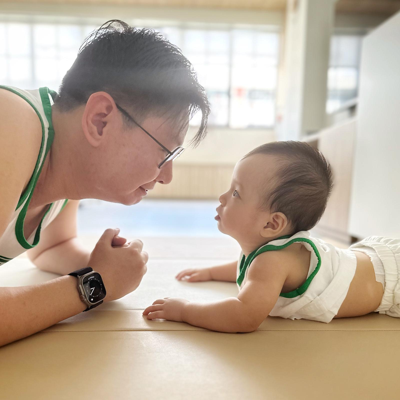 Ken Toh sharing a quiet moment with his baby.